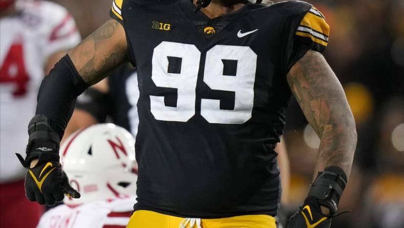 Iowa defensive lineman Noah Shannon (99) reacts after tackling Nebraska running back Anthony Grant for a loss of yards in the fourth quarter during a NCAA football game on Friday, Nov. 25, 2022, at Kinnick Stadium in Iowa City.

Iowavsneb 20221125 Bh