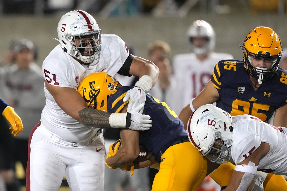 Nov 19, 2022; Berkeley, California, USA; Stanford Cardinal defensive lineman Jaxson Moi (51) tackles California Golden Bears running back Jaydn Ott (6) during the fourth quarter at FTX Field at California Memorial Stadium. Mandatory Credit: Darren Yamashita-USA TODAY Sports