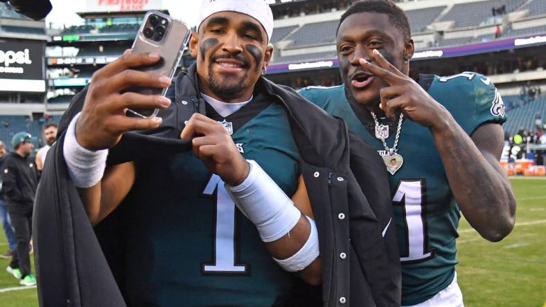 Dec 4, 2022; Philadelphia, Pennsylvania, USA; Philadelphia Eagles quarterback Jalen Hurts (1) and wide receiver A.J. Brown (11) walks off the field after win against the Tennessee Titans at Lincoln Financial Field. Mandatory Credit: Eric Hartline-USA TODAY Sports