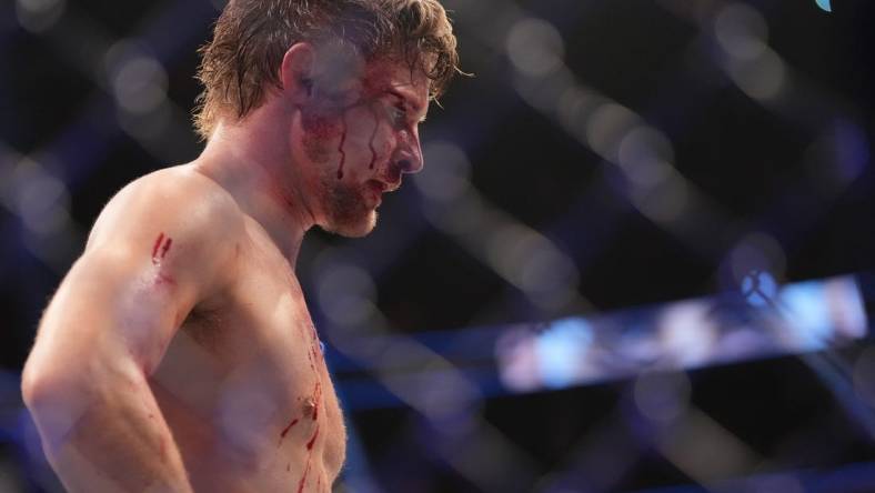 Dec 10, 2022; Las Vegas, Nevada, USA; Bryce Mitchell (red gloves) reacts after the fight against Ilia Topuria (blue gloves) during UFC 282 at T-Mobile Arena. Mandatory Credit: Stephen R. Sylvanie-USA TODAY Sports