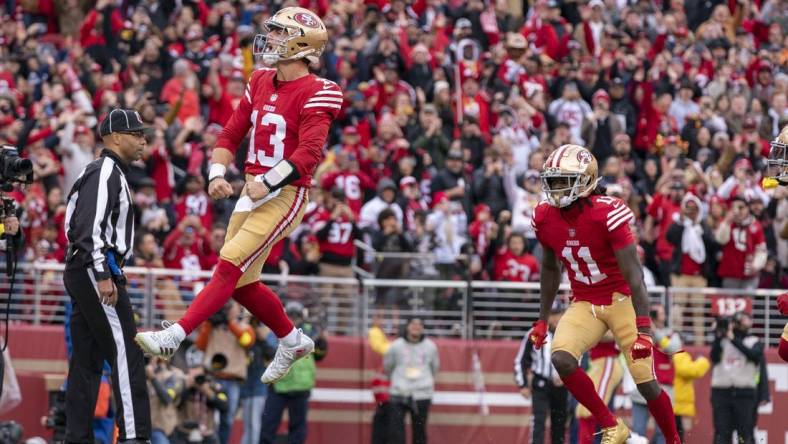December 11, 2022; Santa Clara, California, USA; San Francisco 49ers quarterback Brock Purdy (13) celebrates after scoring a touchdown against the Tampa Bay Buccaneers during the second quarter at Levi's Stadium. Mandatory Credit: Kyle Terada-USA TODAY Sports