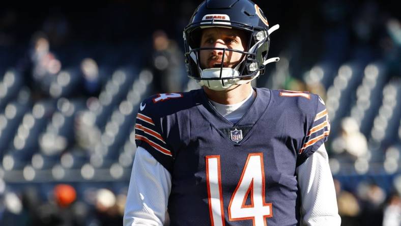 Dec 18, 2022; Chicago, Illinois, Chicago Bears quarterback Nathan Peterman (14) practices before the game against the Philadelphia Eagles  at Soldier Field. Mandatory Credit: Mike Dinovo-USA TODAY Sports