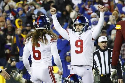 Dec 18, 2022; Landover, Maryland, USA; New York Giants place kicker Graham Gano (9) celebrates with Giants punter Jamie Gillan (6) after making a field goal against the Washington Commanders during the fourth quarter at FedExField. Mandatory Credit: Geoff Burke-USA TODAY Sports