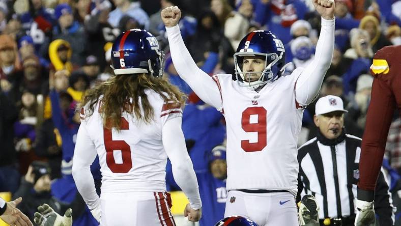 Dec 18, 2022; Landover, Maryland, USA; New York Giants place kicker Graham Gano (9) celebrates with Giants punter Jamie Gillan (6) after making a field goal against the Washington Commanders during the fourth quarter at FedExField. Mandatory Credit: Geoff Burke-USA TODAY Sports