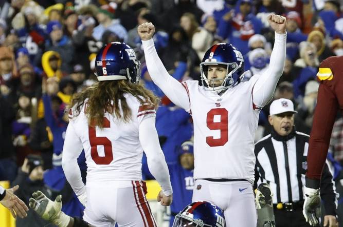 Dec 18, 2022; Landover, Maryland, USA; New York Giants place kicker Graham Gano (9) celebrates with Giants punter Jamie Gillan (6) after making a field goal against the Washington Commanders during the fourth quarter at FedExField. Mandatory Credit: Geoff Burke-USA TODAY Sports