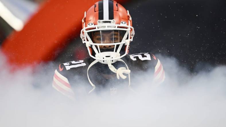 Dec 17, 2022; Cleveland, Ohio, USA; Cleveland Browns cornerback Denzel Ward (21) is introduced before the game between the Browns and the Baltimore Ravens at FirstEnergy Stadium. Mandatory Credit: Ken Blaze-USA TODAY Sports