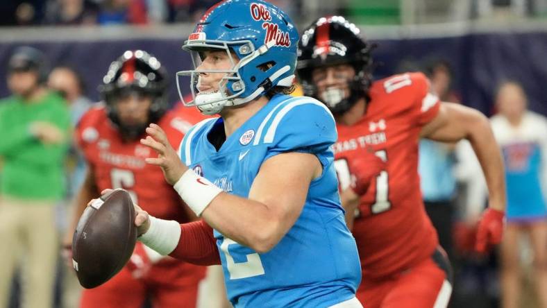 Dec 28, 2022; Houston, Texas, USA; Mississippi Rebels quarterback Jaxson Dart (2) scrambles from Texas Tech Red Raiders in the second half in the 2022 Texas Bowl at NRG Stadium. Mandatory Credit: Thomas Shea-USA TODAY Sports