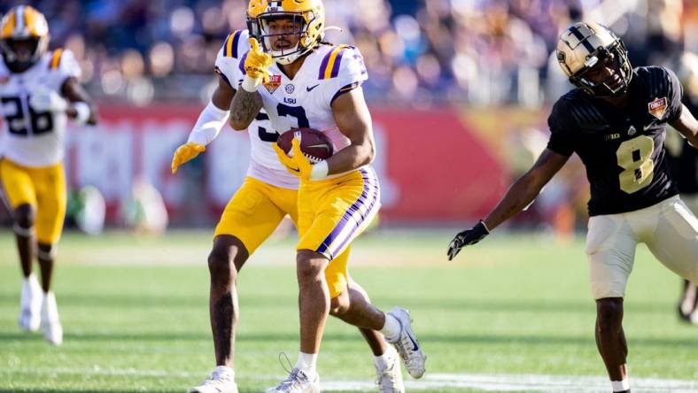 Jan 2, 2023; Orlando, FL, USA; LSU Tigers safety Greg Brooks Jr. (3) gestures after an interception during the second half against the Purdue Boilermakers at Camping World Stadium. Mandatory Credit: Matt Pendleton-USA TODAY Sports