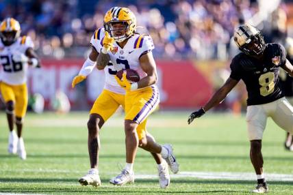 Jan 2, 2023; Orlando, FL, USA; LSU Tigers safety Greg Brooks Jr. (3) gestures after an interception during the second half against the Purdue Boilermakers at Camping World Stadium. Mandatory Credit: Matt Pendleton-USA TODAY Sports