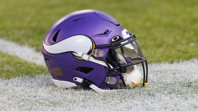 Jan 1, 2023; Green Bay, Wisconsin, USA;  A Minnesota Vikings helmet sits on the field during warmups prior to the game against the Green Bay Packers at Lambeau Field. Mandatory Credit: Jeff Hanisch-USA TODAY Sports