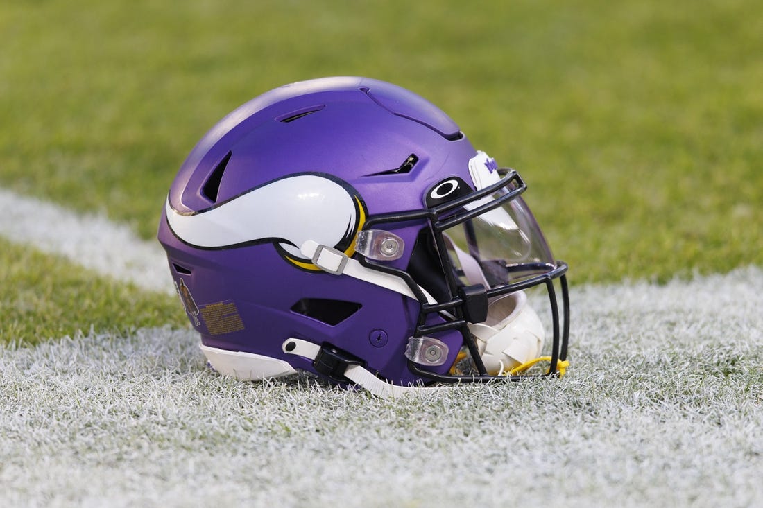 Jan 1, 2023; Green Bay, Wisconsin, USA;  A Minnesota Vikings helmet sits on the field during warmups prior to the game against the Green Bay Packers at Lambeau Field. Mandatory Credit: Jeff Hanisch-USA TODAY Sports