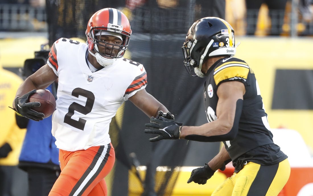 Jan 8, 2023; Pittsburgh, Pennsylvania, USA;  Cleveland Browns wide receiver Amari Cooper (2) runs after a catch as Pittsburgh Steelers safety Minkah Fitzpatrick (39) chases during the fourth quarter at Acrisure Stadium. Pittsburgh won 28-14. Mandatory Credit: Charles LeClaire-USA TODAY Sports