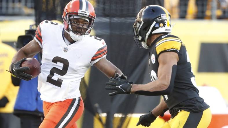 Jan 8, 2023; Pittsburgh, Pennsylvania, USA;  Cleveland Browns wide receiver Amari Cooper (2) runs after a catch as Pittsburgh Steelers safety Minkah Fitzpatrick (39) chases during the fourth quarter at Acrisure Stadium. Pittsburgh won 28-14. Mandatory Credit: Charles LeClaire-USA TODAY Sports