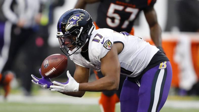 Jan 8, 2023; Cincinnati, Ohio, USA; Baltimore Ravens running back Kenyan Drake (17) makes a catch during the fourth quarter against the Cincinnati Bengals at Paycor Stadium. Mandatory Credit: Joseph Maiorana-USA TODAY Sports