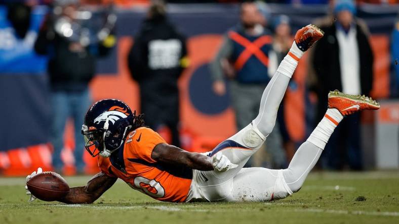 Jan 8, 2023; Denver, Colorado, USA; Denver Broncos wide receiver Jerry Jeudy (10) dives to recover a fumble in the fourth quarter against the Los Angeles Chargers at Empower Field at Mile High. Mandatory Credit: Isaiah J. Downing-USA TODAY Sports