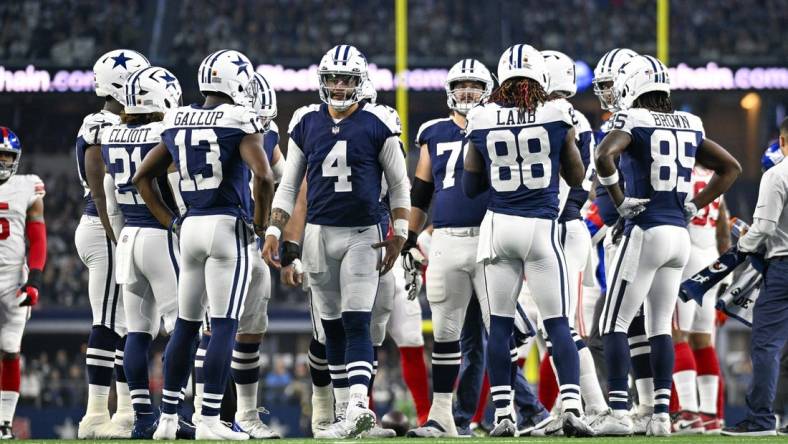 Nov 24, 2022; Arlington, Texas, USA; Dallas Cowboys running back Ezekiel Elliott (21) and wide receiver Michael Gallup (13) and quarterback Dak Prescott (4) and wide receiver CeeDee Lamb (88) and wide receiver Noah Brown (85) in the huddle during the game between the Dallas Cowboys and the New York Giants at AT&T Stadium. Mandatory Credit: Jerome Miron-USA TODAY Sports