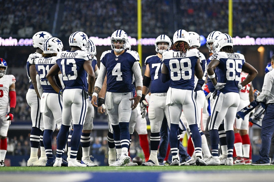 Nov 24, 2022; Arlington, Texas, USA; Dallas Cowboys running back Ezekiel Elliott (21) and wide receiver Michael Gallup (13) and quarterback Dak Prescott (4) and wide receiver CeeDee Lamb (88) and wide receiver Noah Brown (85) in the huddle during the game between the Dallas Cowboys and the New York Giants at AT&T Stadium. Mandatory Credit: Jerome Miron-USA TODAY Sports