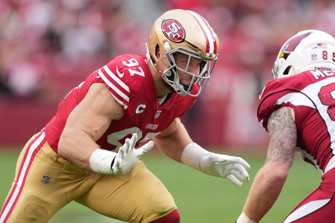 Jan 8, 2023; Santa Clara, California, USA; San Francisco 49ers defensive end Nick Bosa (97) rushes against Arizona Cardinals tight end Trey McBride (85) during the third quarter at Levi's Stadium. Mandatory Credit: Darren Yamashita-USA TODAY Sports