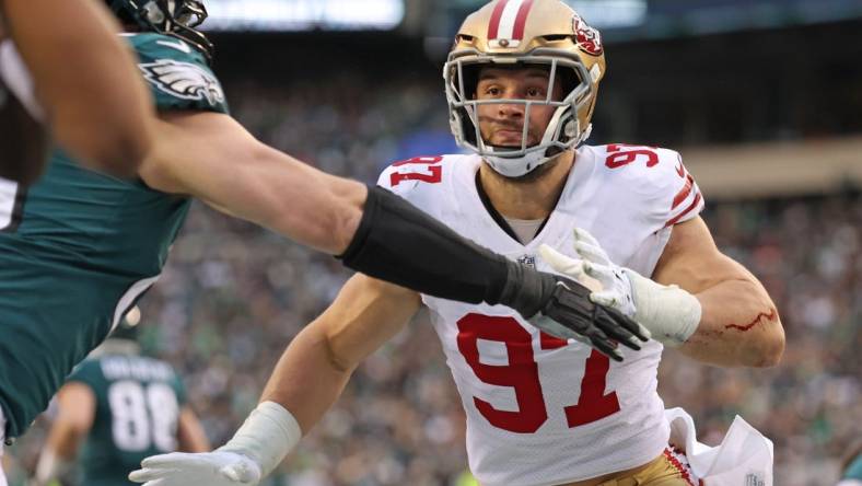 Jan 29, 2023; Philadelphia, Pennsylvania, USA; San Francisco 49ers defensive end Nick Bosa (97) battles with Philadelphia Eagles offensive tackle Lane Johnson (65) during the second quarter in the NFC Championship game at Lincoln Financial Field. Mandatory Credit: Bill Streicher-USA TODAY Sports