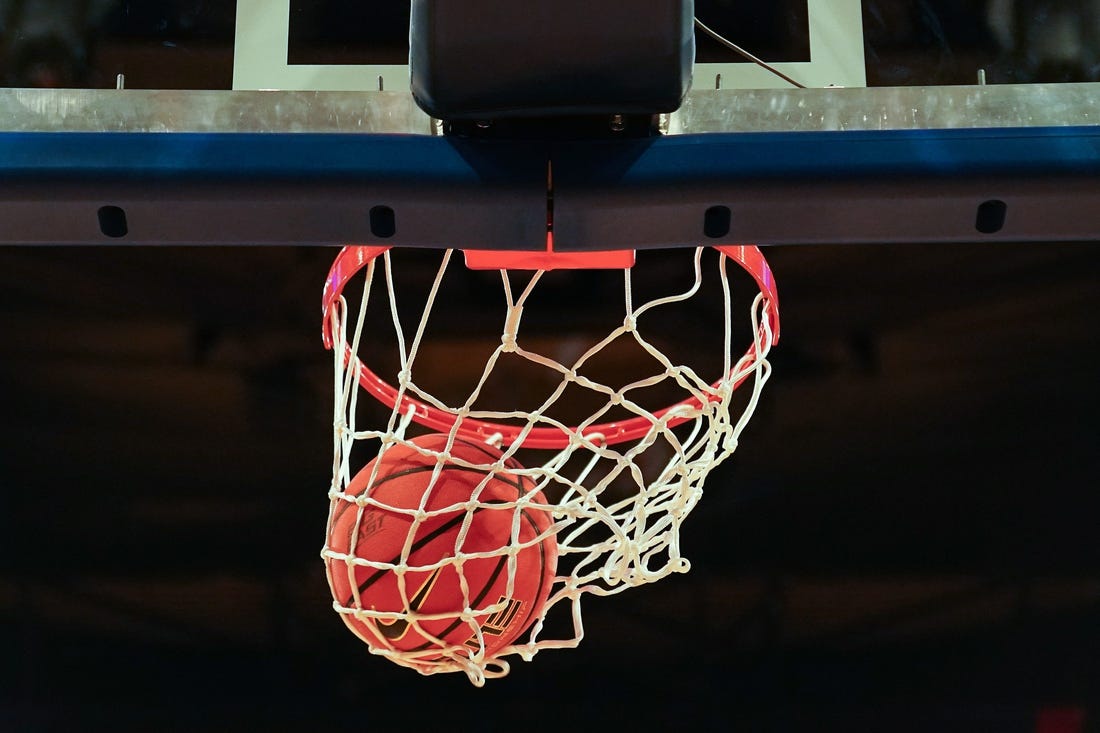 A basketball goes through the hoop during warm ups before the first half of an NCAA college basketball game between the Creighton Bluejays and the Xavier Musketeers during the semifinal round of the Big East Conference tournament, Friday, March 10, 2023, at Madison Square Garden in New York.

Xavier Creighton Big East Basketball Tournament March 10 0279