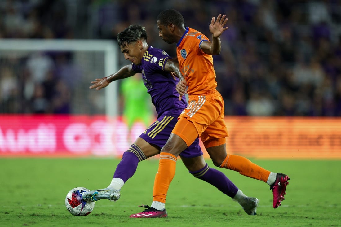 Mar 4, 2023; Orlando, Florida, USA;  Orlando City SC forward Facundo Torres (17) controls the ball from FC Cincinnati defender Ray Gaddis (28) in the second half at Exploria Stadium. Mandatory Credit: Nathan Ray Seebeck-USA TODAY Sports