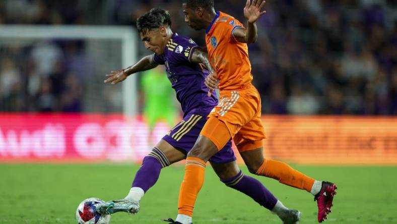 Mar 4, 2023; Orlando, Florida, USA;  Orlando City SC forward Facundo Torres (17) controls the ball from FC Cincinnati defender Ray Gaddis (28) in the second half at Exploria Stadium. Mandatory Credit: Nathan Ray Seebeck-USA TODAY Sports