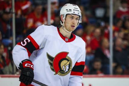 Mar 12, 2023; Calgary, Alberta, CAN; Ottawa Senators defenseman Jake Sanderson (85) skates against the Calgary Flames during the second period at Scotiabank Saddledome. Mandatory Credit: Sergei Belski-USA TODAY Sports