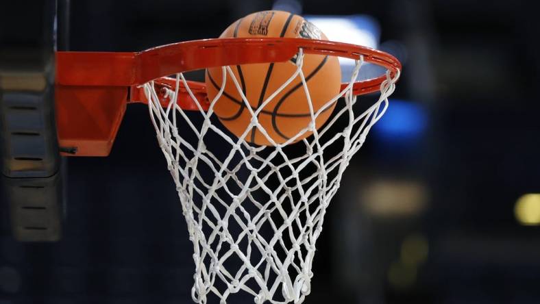 Mar 16, 2023; Columbus, OH, USA; A ball enters the hoop during NCAA Tournament First Round Columbus Practice at Nationwide Arena. Mandatory Credit: Joseph Maiorana-USA TODAY Sports