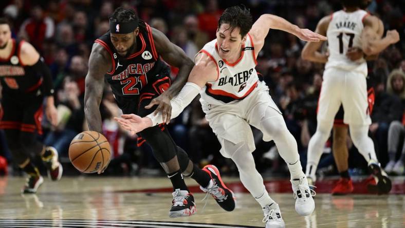 Mar 24, 2023; Portland, Oregon, USA; Chicago Bulls guard Patrick Beverley (21) steals the basketball away from Portland Trail Blazers guard Ryan Arcidiacono (51) during the first half at Moda Center. Mandatory Credit: Troy Wayrynen-USA TODAY Sports