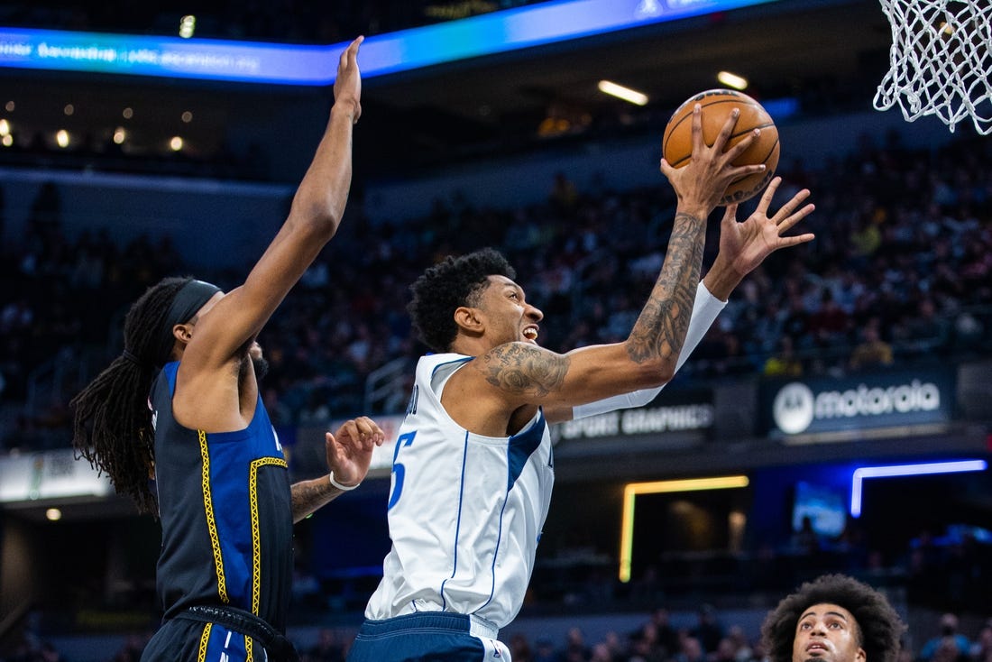 Mar 27, 2023; Indianapolis, Indiana, USA; Dallas Mavericks forward Christian Wood (35) shoots the ball while Indiana Pacers forward Isaiah Jackson (22) defends in the first quarter at Gainbridge Fieldhouse. Mandatory Credit: Trevor Ruszkowski-USA TODAY Sports