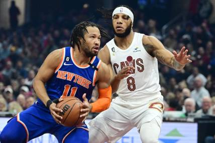 Mar 31, 2023; Cleveland, Ohio, USA; New York Knicks guard Jalen Brunson (11) drives to the basket against Cleveland Cavaliers forward Lamar Stevens (8) during the first half at Rocket Mortgage FieldHouse. Mandatory Credit: Ken Blaze-USA TODAY Sports