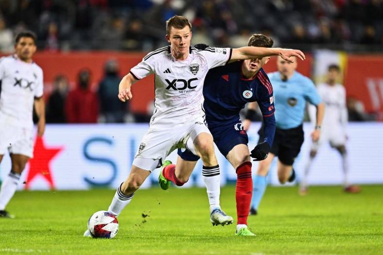 Apr 1, 2023; Chicago, Illinois, USA;  DC United midfielder Chris Durkin (8) controls the ball against the Chicago Fire FC at Soldier Field. Mandatory Credit: Jamie Sabau-USA TODAY Sports