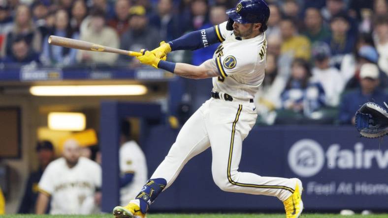 Apr 4, 2023; Milwaukee, Wisconsin, USA;  Milwaukee Brewers center fielder Garrett Mitchell (5) hits a home run during the seventh inning against the New York Mets at American Family Field. Mandatory Credit: Jeff Hanisch-USA TODAY Sports