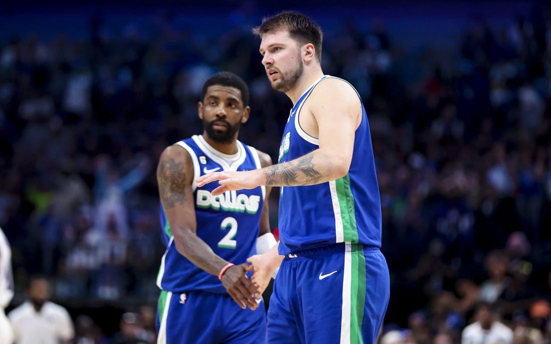 Apr 5, 2023; Dallas, Texas, USA;  Dallas Mavericks guard Luka Doncic (77) and Dallas Mavericks guard Kyrie Irving (2) react during the fourth quarter against the Sacramento Kings at American Airlines Center. Mandatory Credit: Kevin Jairaj-USA TODAY Sports