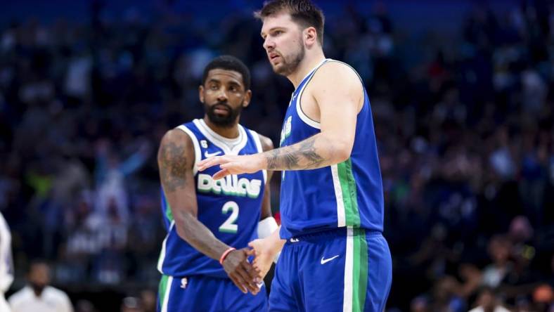 Apr 5, 2023; Dallas, Texas, USA;  Dallas Mavericks guard Luka Doncic (77) and Dallas Mavericks guard Kyrie Irving (2) react during the fourth quarter against the Sacramento Kings at American Airlines Center. Mandatory Credit: Kevin Jairaj-USA TODAY Sports