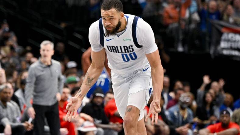 Apr 7, 2023; Dallas, Texas, USA; Dallas Mavericks center JaVale McGee (00) celebrates after making a three point shot against the Chicago Bulls during the first half at the American Airlines Center. Mandatory Credit: Jerome Miron-USA TODAY Sports