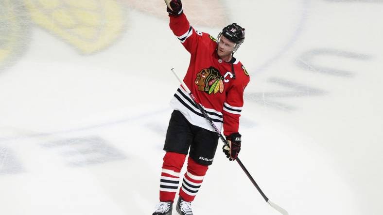 Apr 13, 2023; Chicago, Illinois, USA; Chicago Blackhawks center Jonathan Toews (19) is honored after the game against the Philadelphia Flyers. He played his last game as a Blackhawk, at United Center. Mandatory Credit: David Banks-USA TODAY Sports