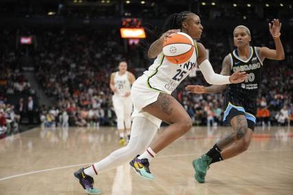 May 13, 2023; Toronto, Ontario, Canada; Minnesota Lynx guard Tiffany Mitchell (25) drives to the net against Chicago Sky guard Courtney Williams (10) during the second half at Scotiabank Arena. Mandatory Credit: John E. Sokolowski-USA TODAY Sports