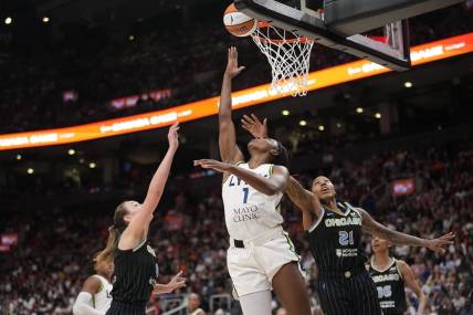 May 13, 2023; Toronto, Ontario, Canada; Minnesota Lynx forward Diamond Miller (1) goes to make a basket against Chicago Sky forward Robyn Parks (21) and forward Alanna Smith (8) during the second half at Scotiabank Arena. Mandatory Credit: John E. Sokolowski-USA TODAY Sports