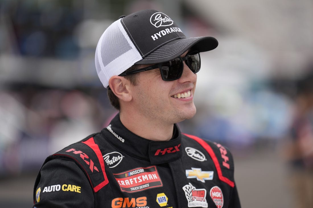 May 19, 2023; North Wilkesboro, North Carolina, USA; NASCAR Camping World Truck Series driver Christian Eckes smiles before truck practice at North Wilkesboro Speedway. Mandatory Credit: Jim Dedmon-USA TODAY Sports