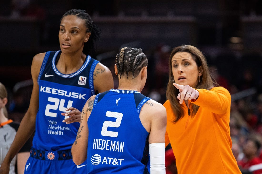 May 19, 2023; Indianapolis, Indiana, USA; Connecticut Sun head coach Stephanie White talks with guard Natisha Hiedeman (2) in the first half against the Indiana Fever at Gainbridge Fieldhouse. Mandatory Credit: Trevor Ruszkowski-USA TODAY Sports