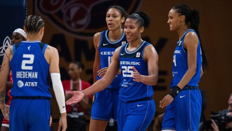 May 19, 2023; Indianapolis, Indiana, USA; Connecticut Sun forward Alyssa Thomas (25) celebrates a and one with teammates in the second half against the Indiana Fever at Gainbridge Fieldhouse. Mandatory Credit: Trevor Ruszkowski-USA TODAY Sports