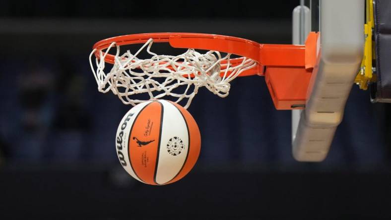 May 25, 2023; Los Angeles, California, USA; Wilson official basketball with WNBA logo goes through the net during the game between the LA Sparks and the Las Vegas Aces at Crypto.com Arena. Mandatory Credit: Kirby Lee-USA TODAY Sports