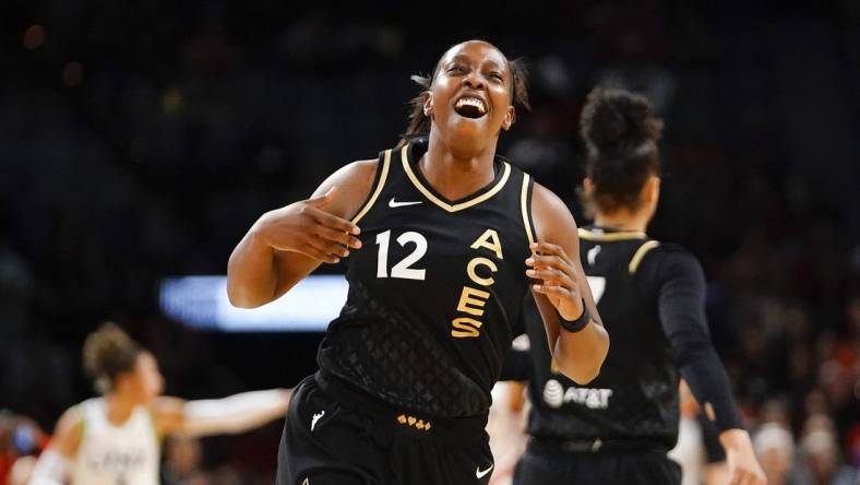 May 28, 2023; Las Vegas, Nevada, USA; Las Vegas Aces guard Chelsea Gray (12) reacts after scoring against the Minnesota Lynx during the first quarter at Michelob Ultra Arena. Mandatory Credit: Lucas Peltier-USA TODAY Sports