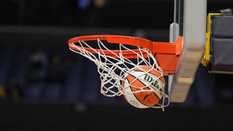 May 25, 2023; Los Angeles, California, USA; Wilson official basketball with WNBA logo goes through the net during the game between the LA Sparks and the Las Vegas Aces at Crypto.com Arena. Mandatory Credit: Kirby Lee-USA TODAY Sports