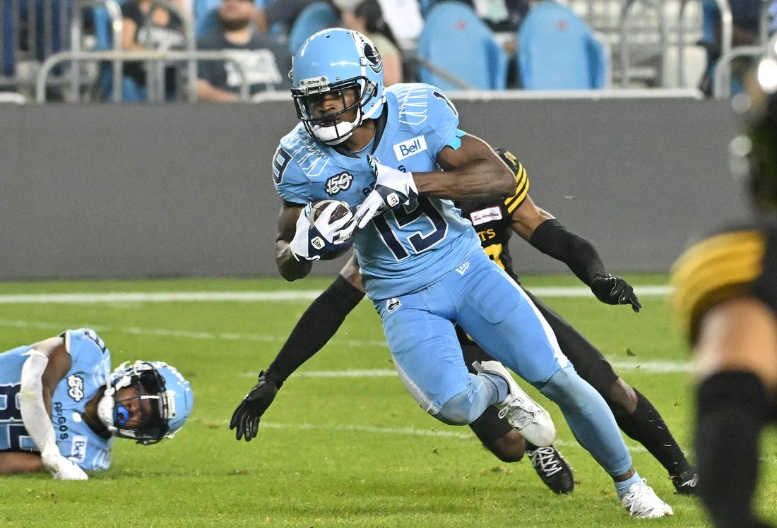 Jun 18, 2023; Toronto, Ontario, CAN; Toronto Argonauts wide receiver Kurleigh Gittens Jr. (19) runs with the ball after catching a pass against the Hamilton Tiger-Cats in the fourth quarter at BMO Field. Mandatory Credit: Dan Hamilton-USA TODAY Sports