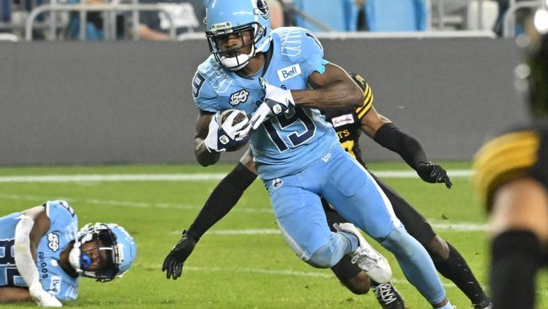 Jun 18, 2023; Toronto, Ontario, CAN; Toronto Argonauts wide receiver Kurleigh Gittens Jr. (19) runs with the ball after catching a pass against the Hamilton Tiger-Cats in the fourth quarter at BMO Field. Mandatory Credit: Dan Hamilton-USA TODAY Sports