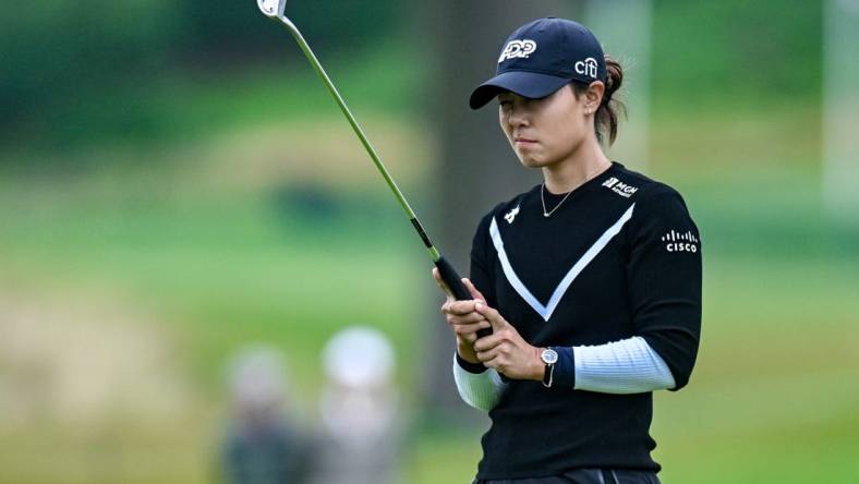 Jun 23, 2023; Springfield, New Jersey, USA; Danielle Kang lines up a shot from the bunker on the 18th hole during the second round of the KPMG Women's PGA Championship golf tournament. Mandatory Credit: John Jones-USA TODAY Sports