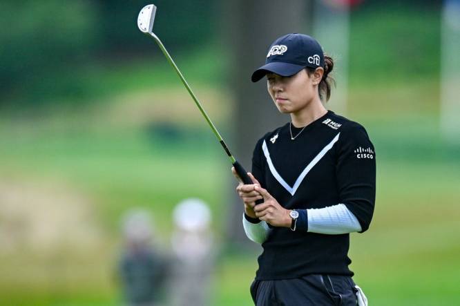 Jun 23, 2023; Springfield, New Jersey, USA; Danielle Kang lines up a shot from the bunker on the 18th hole during the second round of the KPMG Women's PGA Championship golf tournament. Mandatory Credit: John Jones-USA TODAY Sports