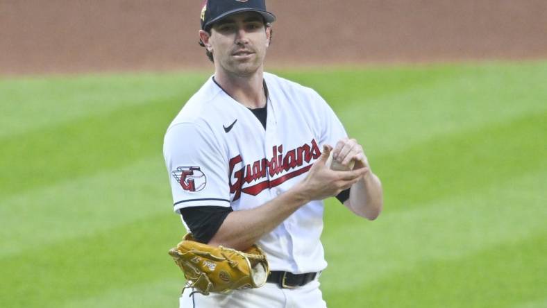 Jul 4, 2023; Cleveland, Ohio, USA; Cleveland Guardians starting pitcher Shane Bieber (57) reacts after giving up a home run in the fifth inning against the Atlanta Braves at Progressive Field. Mandatory Credit: David Richard-USA TODAY Sports